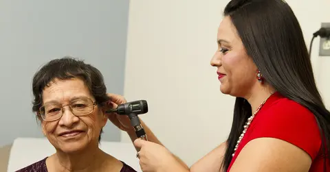 Woman's ear being checked
