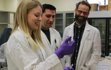 Lowe with students in the lab.