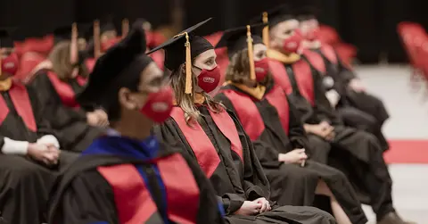 students seated at the graduate school for biomedical sciences ceremony