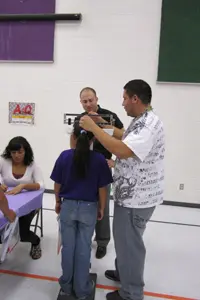 El Paso high school students, in conjunction with Paul L. Foster School of Medicine students, host a health fair for elementary students to promote healthy habits.