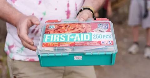 hands holding a first aid kit 
