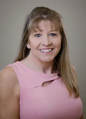 Female TTUHSC pharmacist smiles.
