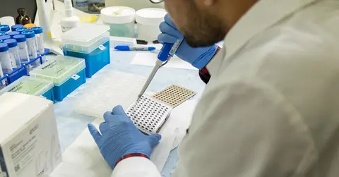 close up of hands working in a medical lab