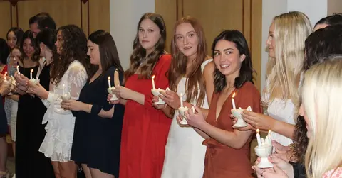 students stand in line for TTUHSC School of Nursing's lamp lighting ceremony