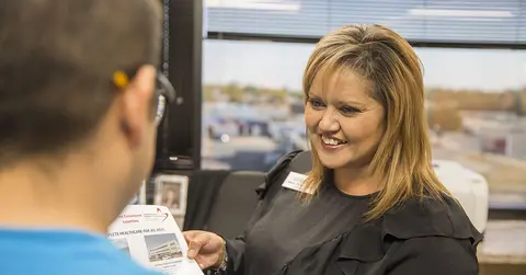 Woman counsels with man at Combest Center
