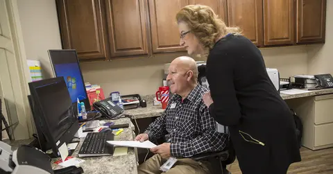 Two people working together at the Combest Center