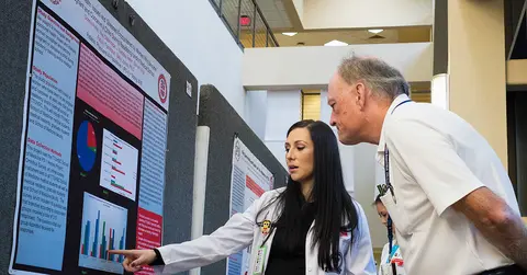 Student presents to professor