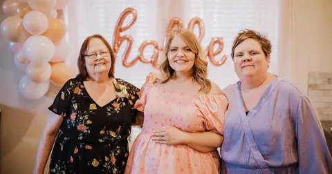 Megan McCrory with her family in front of balloons