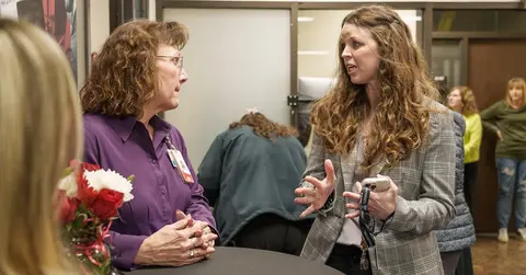 two women mid-conversation