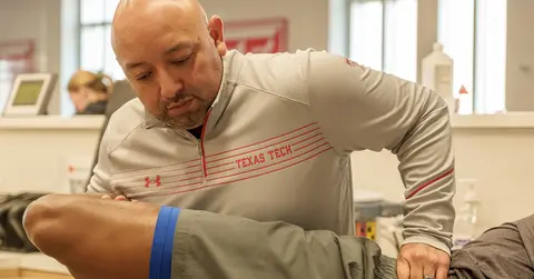 Frank Perez with a patient