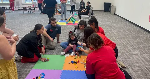 Young girl playing with toys at the IPE toy fair