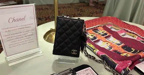 purses on a table for auction