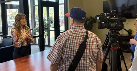 woman speaking in front of video camera