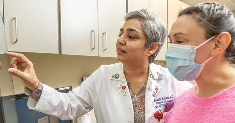 Rakhshanda Rahman, M.D. with a patient
