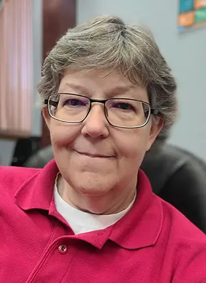 Female TTUHSC educator smiles.