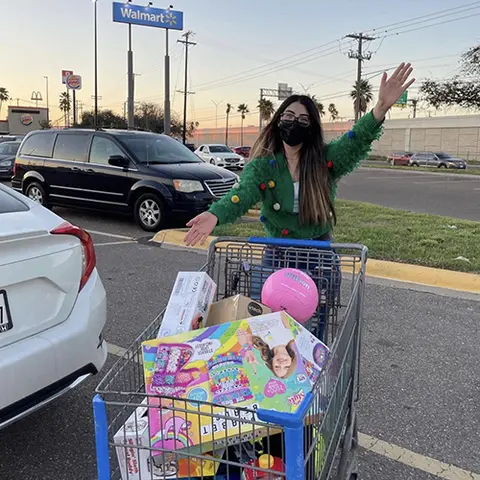 Ballesteros collecting toys for the Christmas event