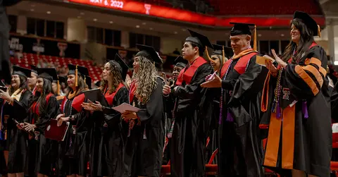 students wearing caps and gowns