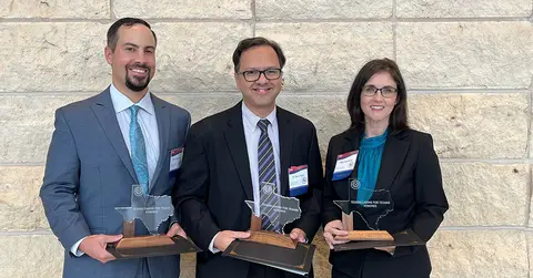 Texans Caring for Texans Award winners standing with their awards