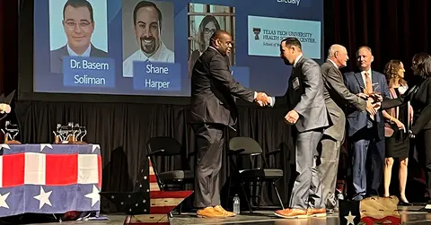 2022 award winners crossing the stage