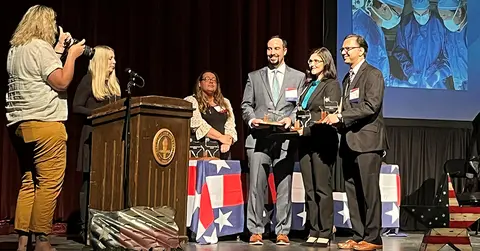 2022 award winners crossing the stage