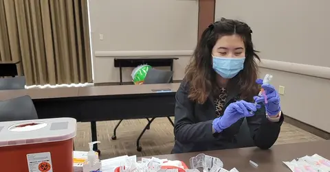 Woman preparing covid vaccines
