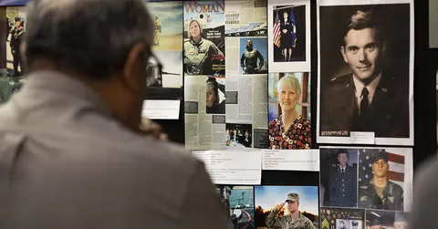 Man views images of veterans