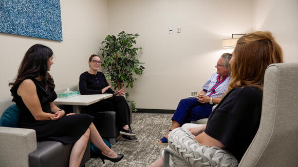 Candid photo of Grady, Winkelman, Jennings, Noble in an office discussing the impact of Endometriosis