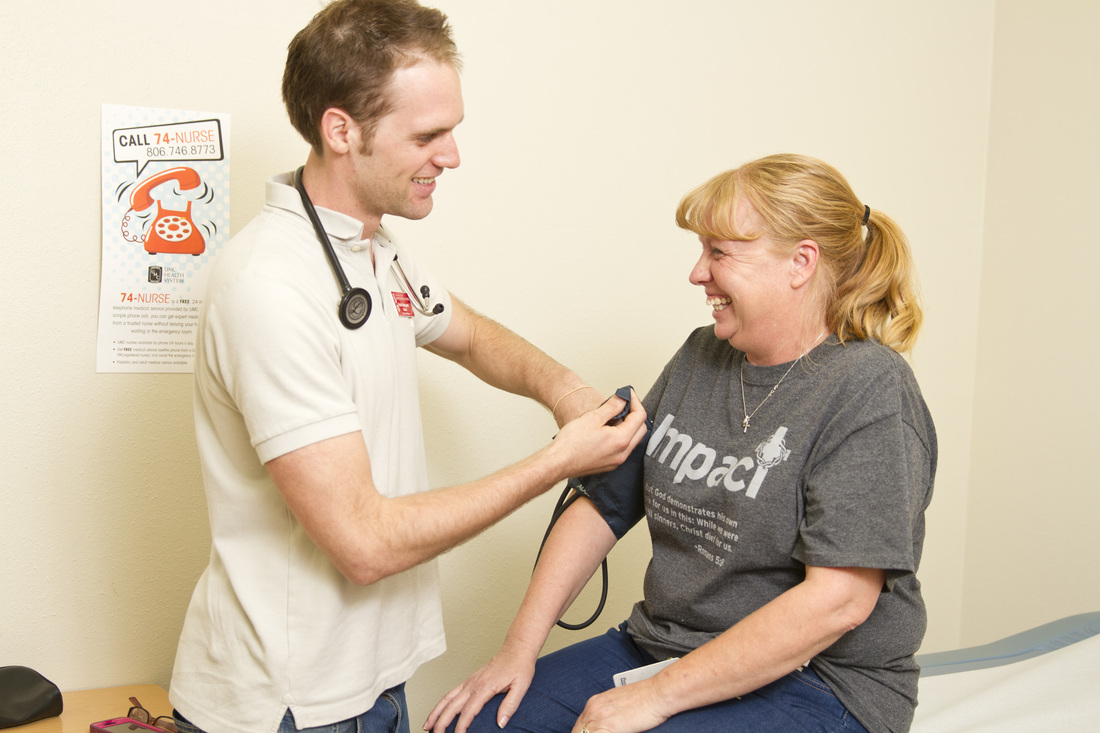 Student taking patient vitals