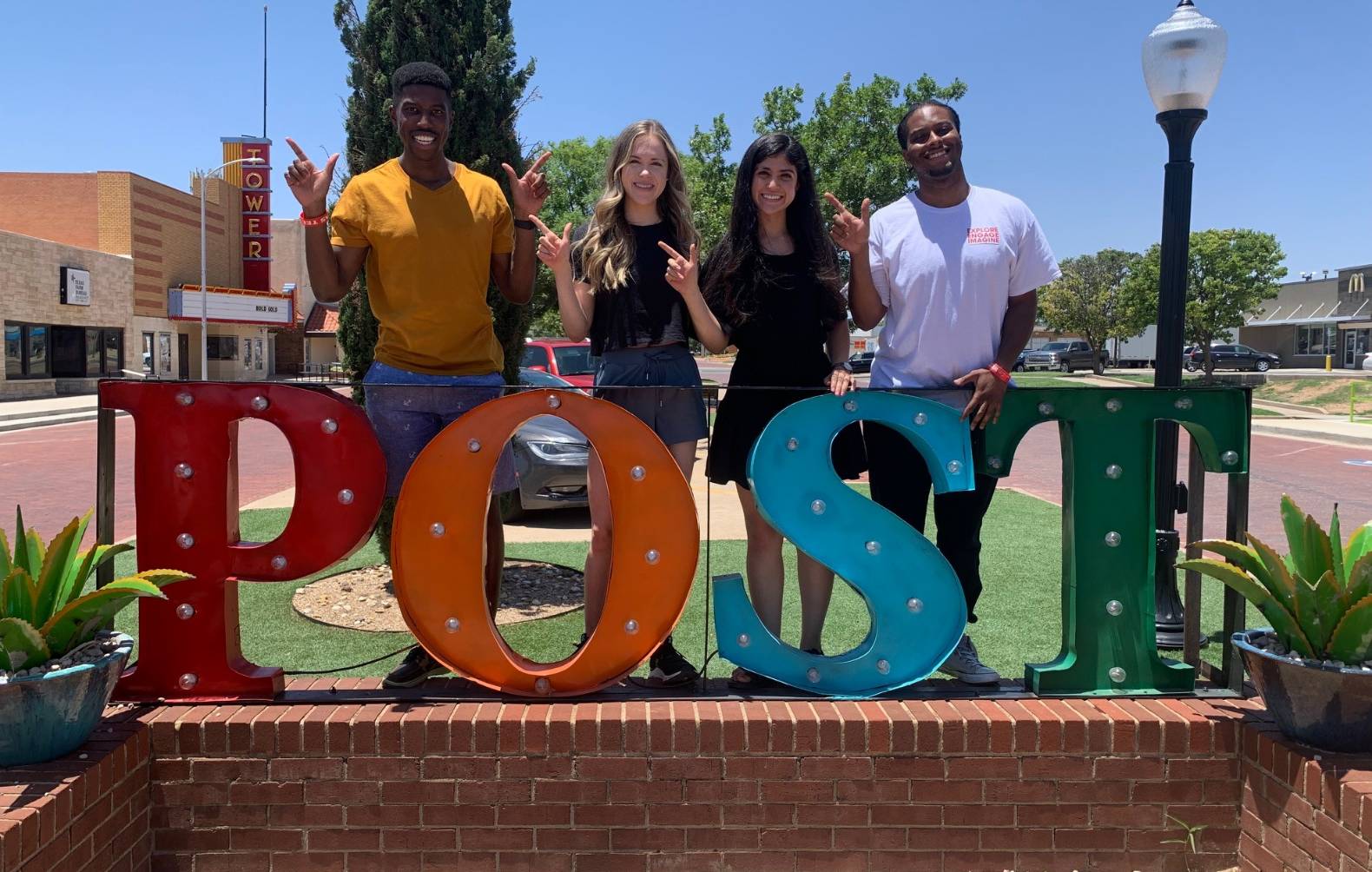 Image of Student Government Officers behind the Post, Texas sign, taken during their officer retreat